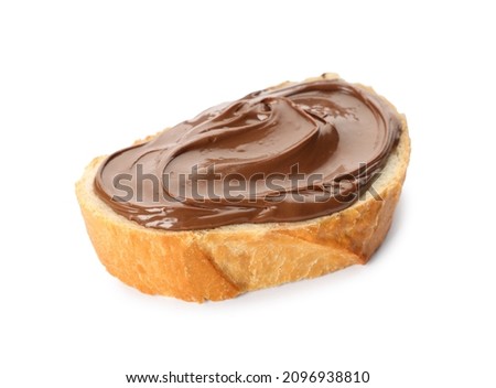 Bread with tasty chocolate spread on white background