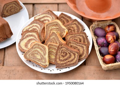 Bread Texture Of Potica Slices With Easter Eggs; Assortment Of Easter Breads: Wheat Rolls With Walnuts, Chocolate Carob Rolls With Almonds And Buckwheat Chocolate Rolls With Peanuts And Mascarpone