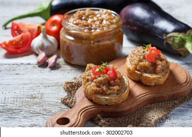 Bread toasts with eggplant caviar. Selective focus
