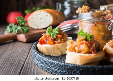 Bread toasts with eggplant caviar. Vegetable appetizer or antipasti. Healthy food for vegetarian