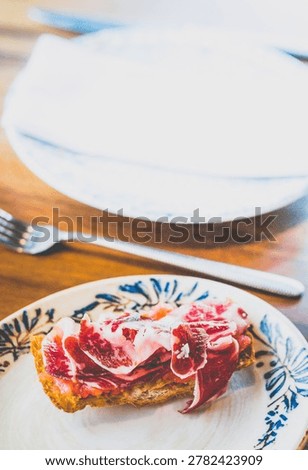 Bread and Tomatoes with Jamon Iberico 36 Months on a dish