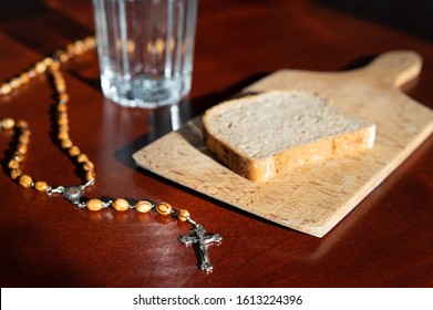 Bread And Water Lent Before Easter With Rosary Beads .