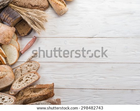 The bread and a wheat on the wooden desk.