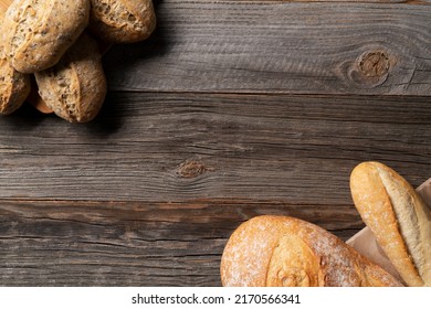 Bread, Whole Grain Buns And Baguettes Placed On The Vintage Wooden Table. Freshly Baked Bread, Bakery Concept.