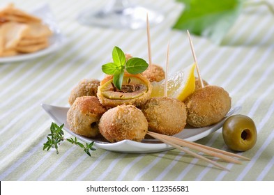 Breaded and baked green olives - a Spanish appetizer - Powered by Shutterstock