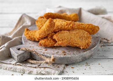 Breaded chicken fillet and batter. Delicious crunchy, hearty meat appetizer.