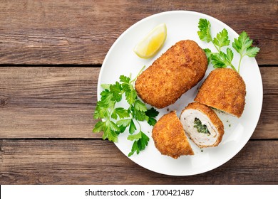 Breaded Chicken Kiev Breast Stuffed With Butter, Garlic And Herbs. Top View