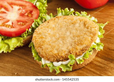 Breaded Chicken Patty Sandwich On A Bun With Lettuce And Tomato