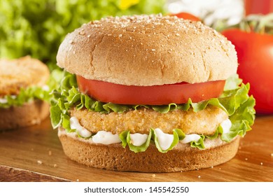 Breaded Chicken Patty Sandwich On A Bun With Lettuce And Tomato