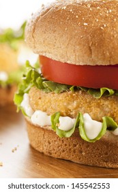 Breaded Chicken Patty Sandwich On A Bun With Lettuce And Tomato