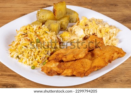
Breaded chicken served with sweet potatoes, biro biro rice and egg farofa. Brazilian food usually served as an executive dish
