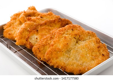 Breaded Chicken Strips On Aluminum Tray On White Background.Chicken Tender Cutlet. 