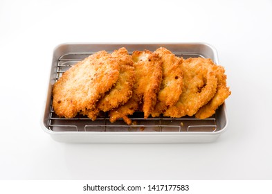 Breaded Chicken Strips On Aluminum Tray On White Background.Chicken Tender Cutlet. 