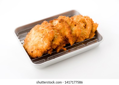 Breaded Chicken Strips On Aluminum Tray On White Background.Chicken Tender Cutlet. 