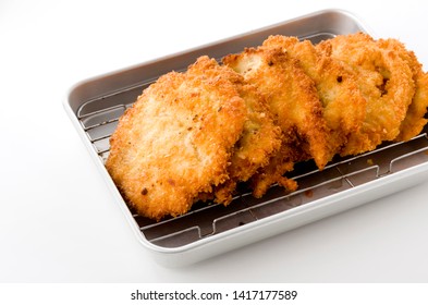 Breaded Chicken Strips On Aluminum Tray On White Background.Chicken Tender Cutlet. 