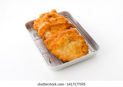 Breaded Chicken Strips On Aluminum Tray On White Background.Chicken Tender Cutlet. 