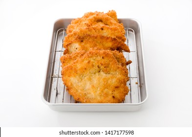 Breaded Chicken Strips On Aluminum Tray On White Background.Chicken Tender Cutlet. 