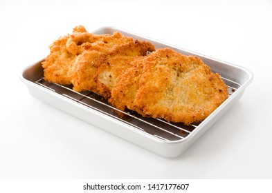 Breaded Chicken Strips On Aluminum Tray On White Background.Chicken Tender Cutlet. 