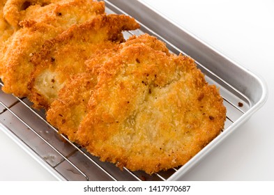 Breaded Chicken Strips On Aluminum Tray On White Background.Chicken Tender Cutlet. 