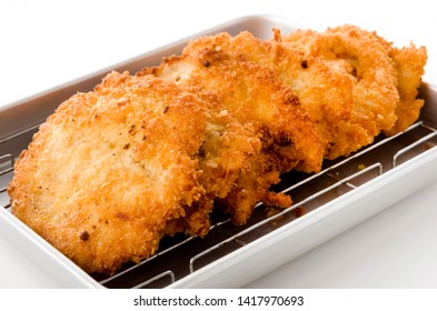 Breaded Chicken Strips On Aluminum Tray On White Background.Chicken Tender Cutlet. 