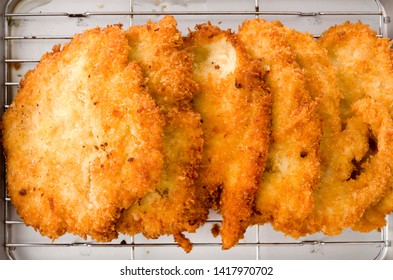 Breaded Chicken Strips On Aluminum Tray On White Background.Chicken Tender Cutlet. 