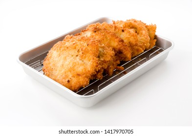 Breaded Chicken Strips On Aluminum Tray On White Background.Chicken Tender Cutlet. 