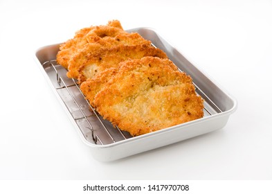 Breaded Chicken Strips On Aluminum Tray On White Background.Chicken Tender Cutlet. 