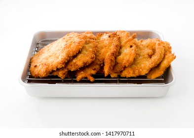 Breaded Chicken Strips On Aluminum Tray On White Background.Chicken Tender Cutlet. 