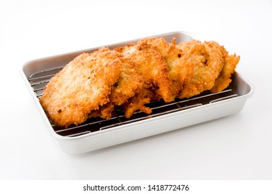 Breaded Chicken Strips On Aluminum Tray On White Background.Chicken Tender Cutlet. 