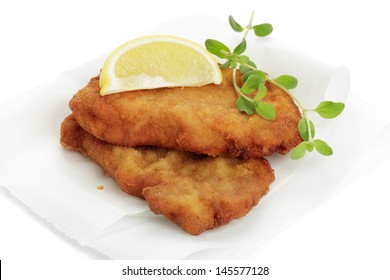 Breaded Cutlet With Lemon Wedges