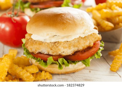 Breaded Fish Sandwich With Tartar Sauce And Fries