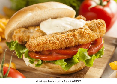 Breaded Fish Sandwich With Tartar Sauce And Fries