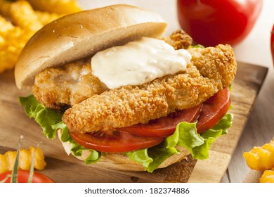 Breaded Fish Sandwich With Tartar Sauce And Fries