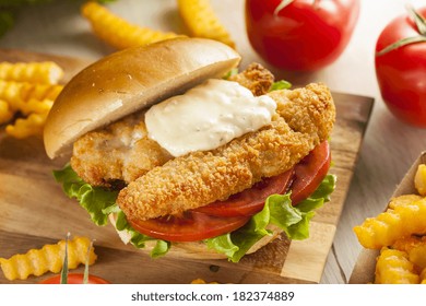 Breaded Fish Sandwich With Tartar Sauce And Fries