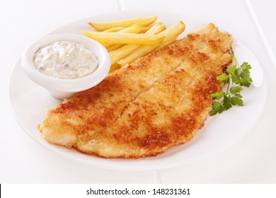 Breaded Fish With Tartare Sauce And Chips.