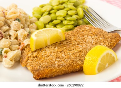 Breaded Pork Cutlet With Pasta Salad And Baby Lima Beans.