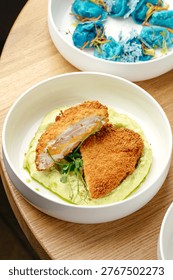 breaded schnitzel and mashed potatoes