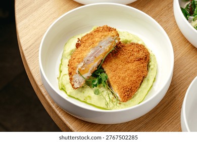breaded schnitzel and mashed potatoes