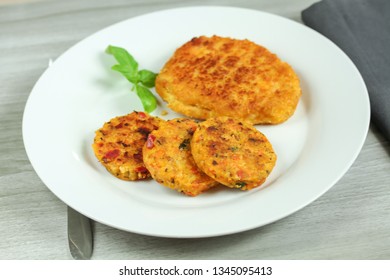 Breaded schnitzel and vegetable pucks