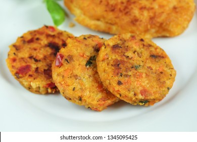 Breaded schnitzel and vegetable pucks
