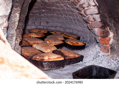 Breads In Old Stone Fireplace, Cook