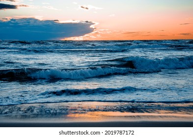 The breadth and power of the sea waves with a wonderful sunset in the background