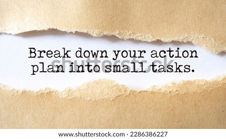 Break down your action plan into small tasks. Words written under torn paper.