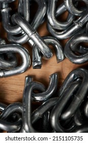 Break Free From The Chains Of Life. Shot Of Metal Chains With A Broken Link.