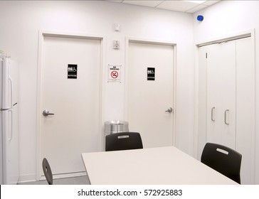 Break Room Bathrooms -  A Company's Employee Break Room, Showing Doors To The Men's And Women's Rooms