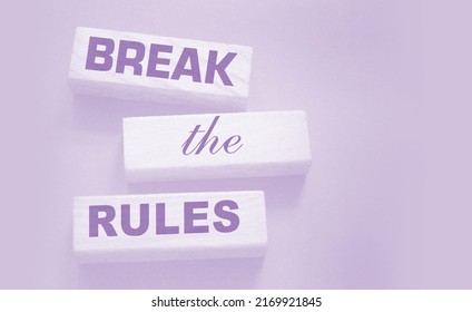 Break The Rules Phrase On Wooden Blocks On Dark Grey. Behavior Concept Or Innovative Business Management Concept