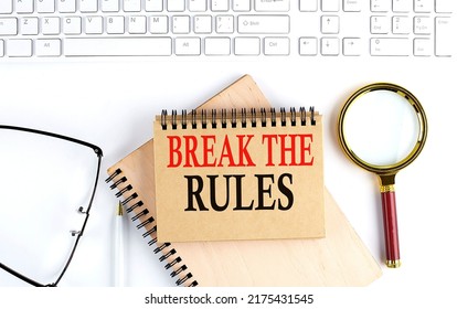 BREAK THE RULES Text In Office Notebook With Keyboard, Magnifier And Glasses , Business Concept