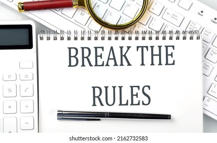 BREAK THE RULES . Text On A Notepad With Calculator And Keyboard,business Concept