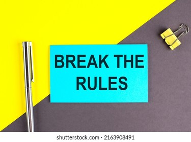 BREAK THE RULES Text Written On A Sticky With Pen On Grey, Yellow Background, Business Concept