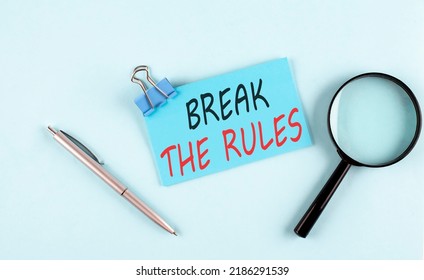 BREAK THE RULES Text Written On A Sticky With Magnifier And Pen, Business Concept